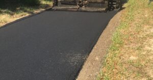Before and after view of asphalt paving services by Workman Asphalt Services