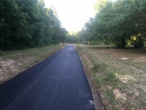 Asphalt paving services road with a smooth finish by Workman Asphalt Services