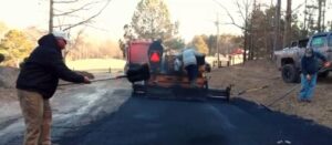 Asphalt paving services being performed on a Gulf Coast driveway