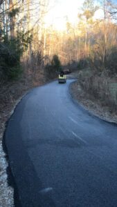 Asphalt paving services being performed on a Gulf Coast driveway