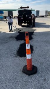 Crew performing professional asphalt paving services on-site