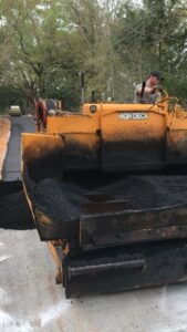 Crew on-site performing asphalt paving by Workman Asphalt Services